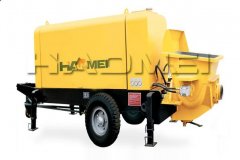 Portable concrete pump is easily carried or moved